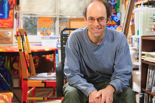 Portrait of an artist with Asperger's in his studio