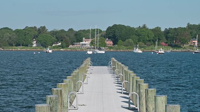 Stonington Borough, Connecticut, USA - Pier Leading Lines Toward Sailboats in Harbor