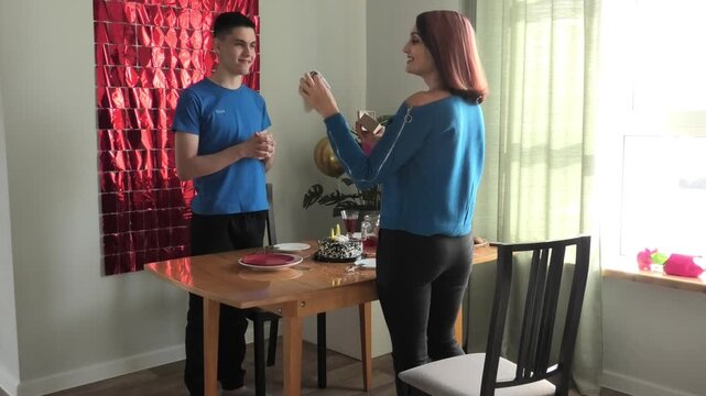 Mother takes out her joke gift of striped socks
