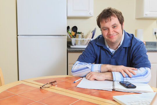 Programmer with Asperger's working on his computer from home