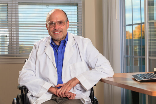 Man with Friedreich's Ataxia and deformed hands as a doctor