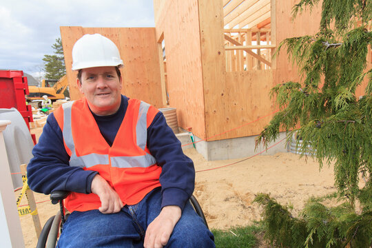 Construction engineer with spinal cord injury at new construction site
