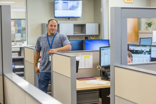 Portrait of an engineer standing at customer service center of electric power plant