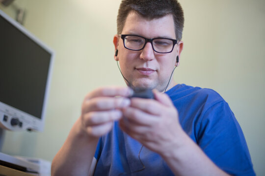 Man with Visual Impairment using his technology to communicate