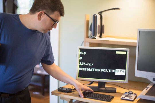 Man with Visual Impairment using his computer