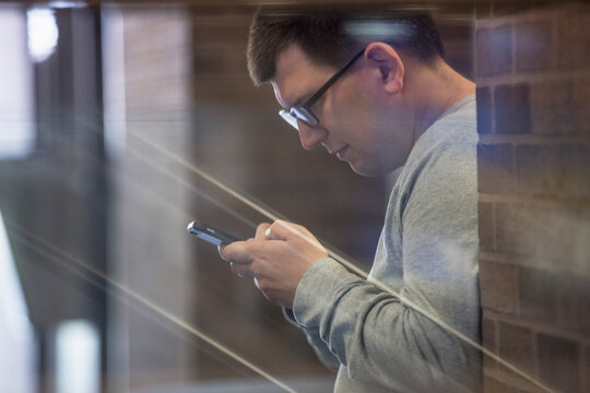 Man with Visual Impairment at school and using his phone