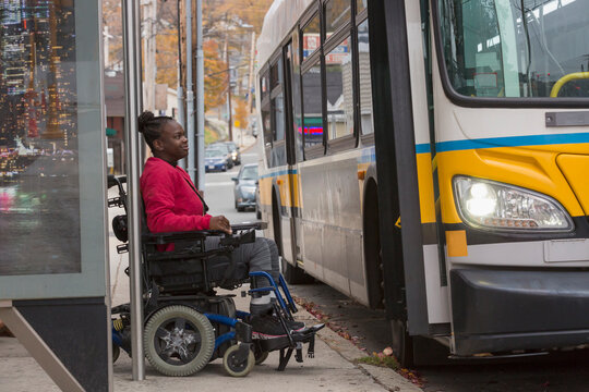 Teen with Cerebral Palsy at bus stop
