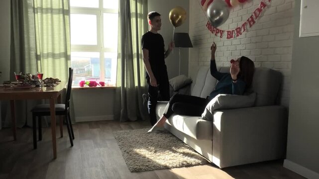 Mother and son throwing a balloon