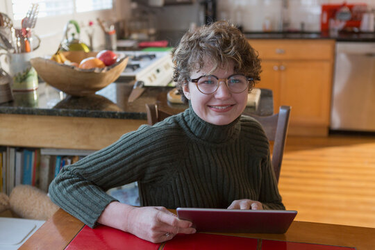Woman with Sjogren-Larsson Syndrome using a digital tablet