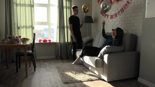 Mother and son throwing a balloon