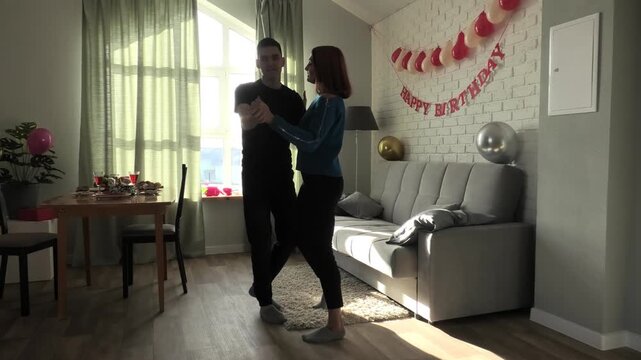 Mother teaches her son to dance