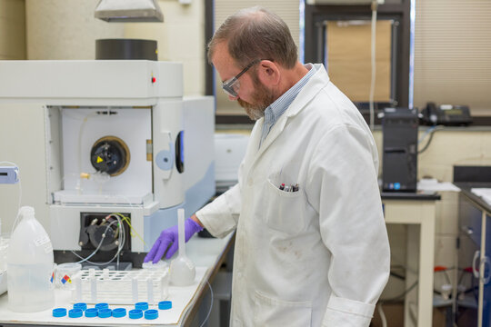 Lab chemist preparing automated water test