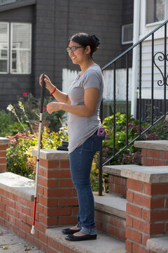 Woman with Visual Impairment using her cane