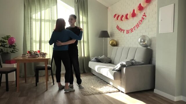 Mother and son dancing slow dance