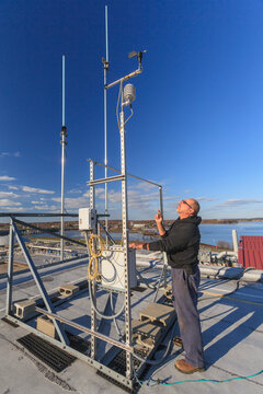 Engineer working with weather sensors