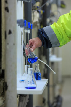 Water department engineer testing water sample