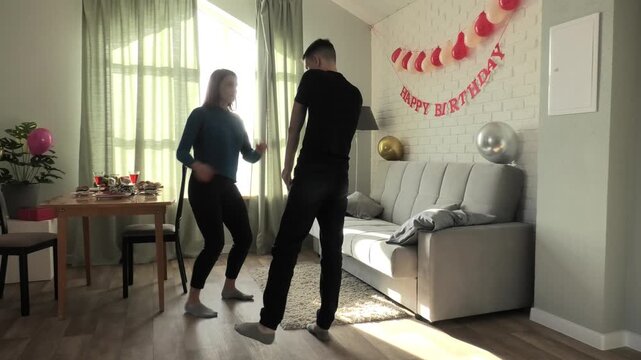 Mother teaches her son to dance