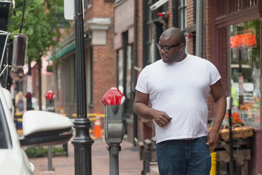 Happy man with ADHD standing at a parking meter
