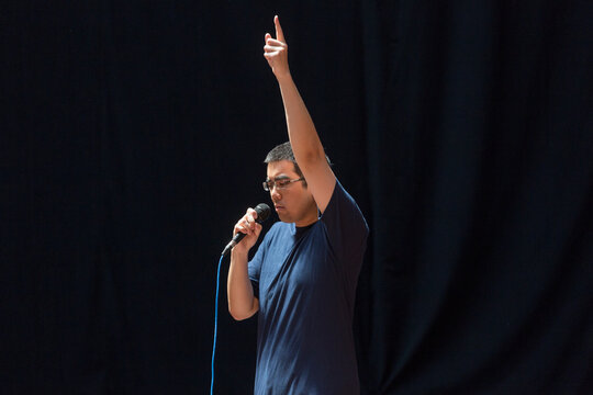 Man with Autism making an announcement on stage