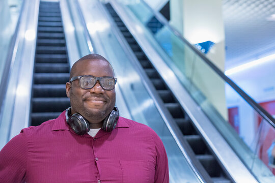 Man with ADHD on an escalator