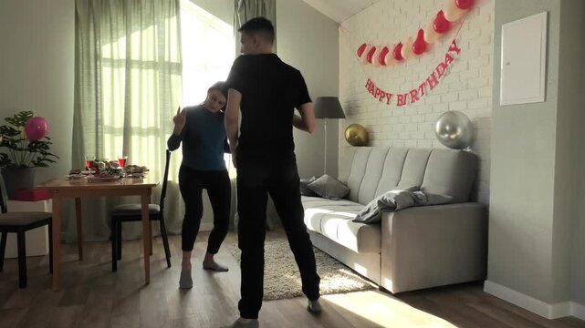Mother and son dancing a fast dance
