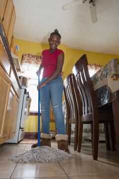 Teen living with Bipolar Disorder cleaning the house