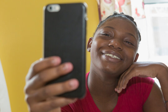 Teen living with Bipolar Disorder looking at phone