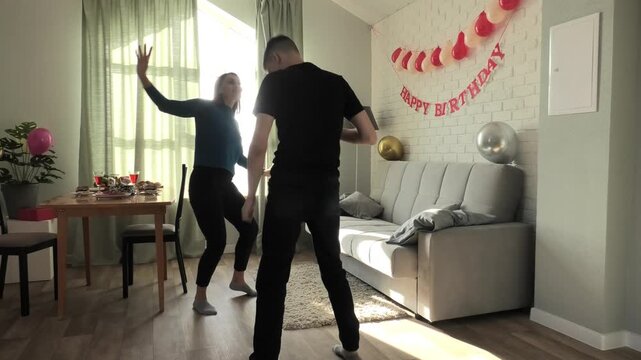 Mother and son dancing a fast dance
