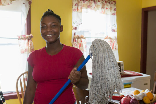 Teen living with Bipolar Disorder cleaning the house