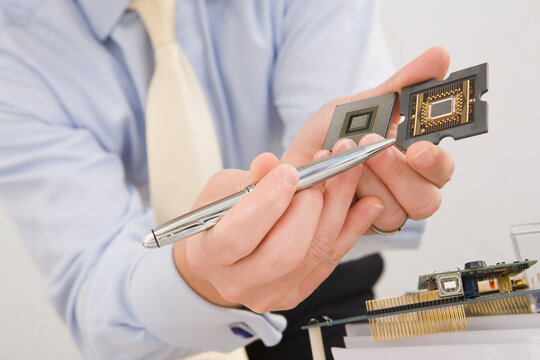 Mid section view of a businessman showing a micro chip