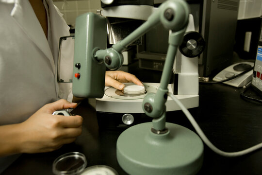 Scientist performing a bacteria count, Membrane filtration method, laboratory