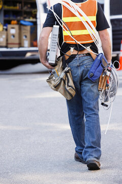 Lineman carrying a modem