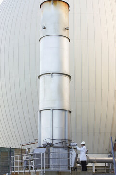 Scientists examining an exhaust stack