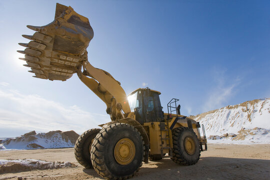 Low angle view of a front-end loader at a construction site