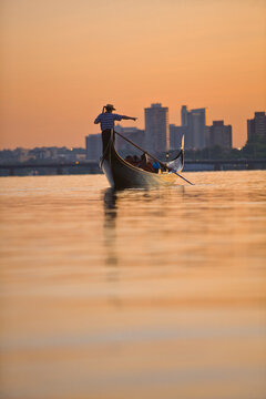 Man rowing a gondola, Mass Avenue Bridge, Charles River