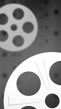 Film reel rotating on metal sprocket vintage cinematic footage Motion Background