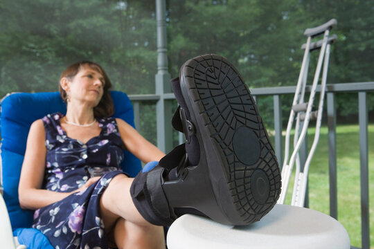 Middle-aged disabled woman sitting on a chair