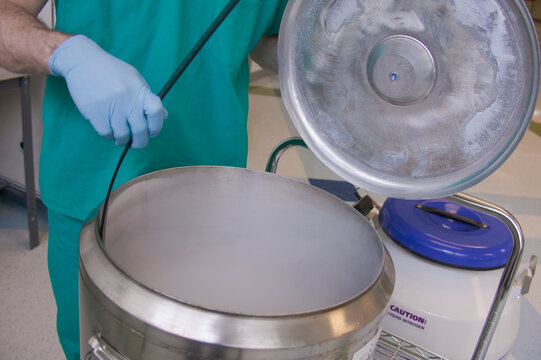 Scientist working on a liquid nitrogen container
