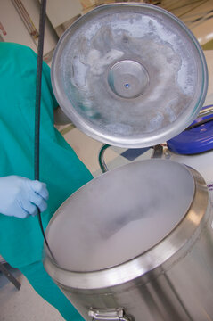Scientist working on a liquid nitrogen container
