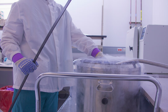 Scientist working on a liquid nitrogen container
