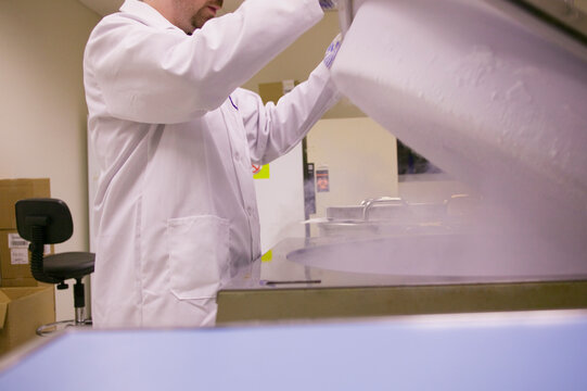 Scientist working on a liquid nitrogen container