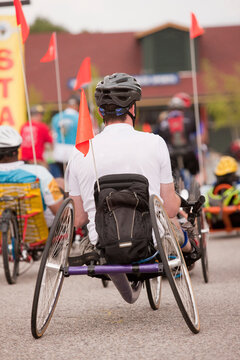 Man with spinal cord injury participating in a tricycle race