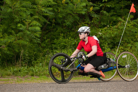 Woman with degenerative hip participating in a handcycle race