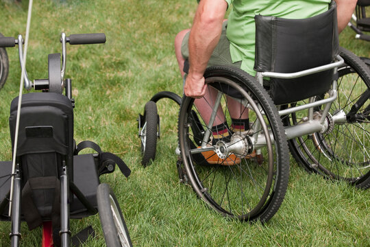 Man sitting in a wheelchair in a park