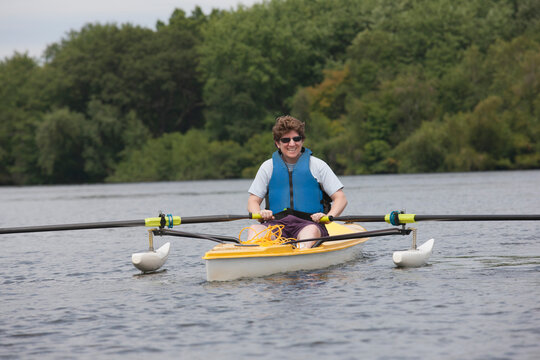 Woman with spinal cord injury preparing for a boat race