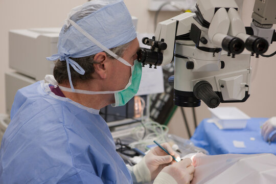 Ophthalmologist making incision during cataract surgery