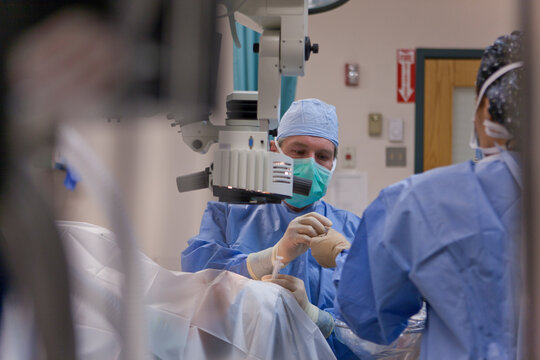 Ophthalmologist performing cataract surgery