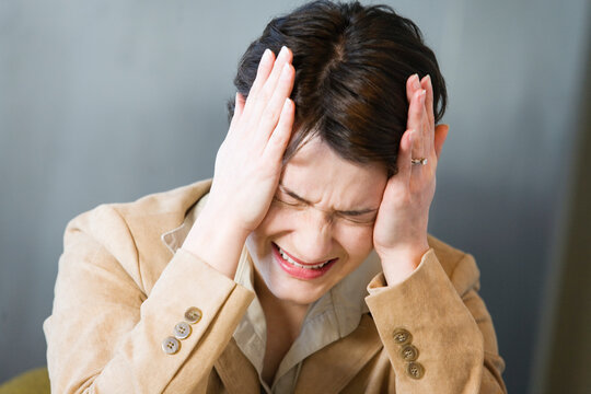 Business woman crying in pain