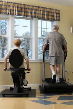 Senior couple exercising in the gym