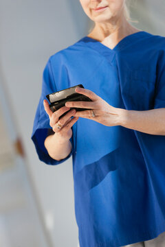 Nurse text messaging on her smartphone
